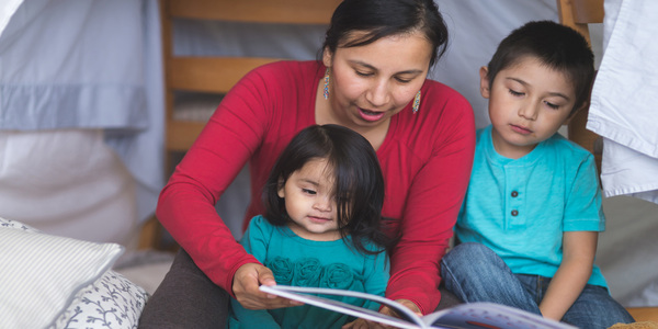 Mother Reading To Children