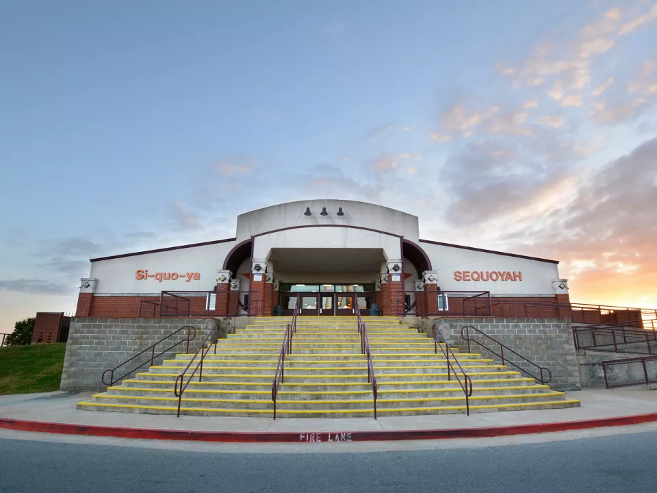 A concrete staircase leads up to the front doors of Sequoyah High School.