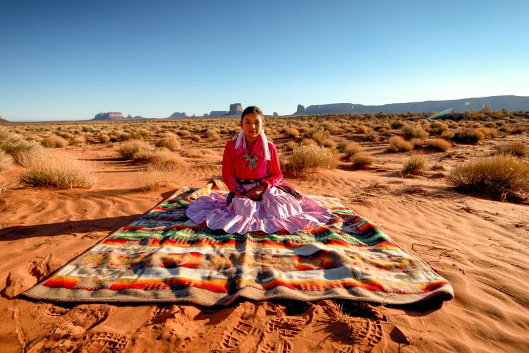 young-woman-blanket-desert