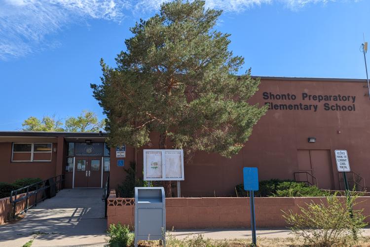 Front of a brick school building.