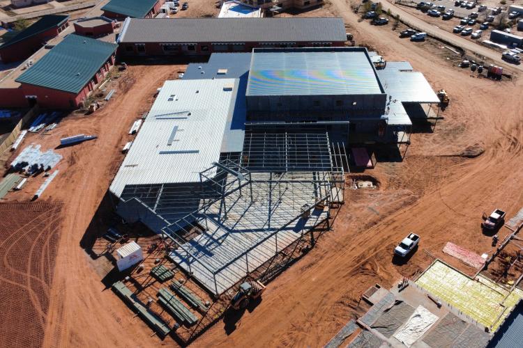 Aerial view of construction work at Many Farms High School campus.