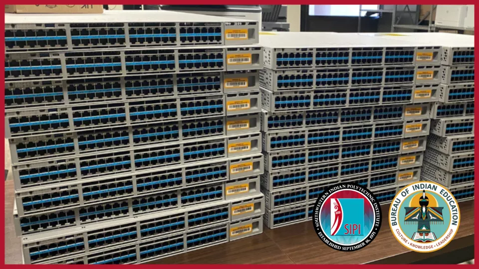 Three stacks of server room switches with ethernet ports used to wire network connections.