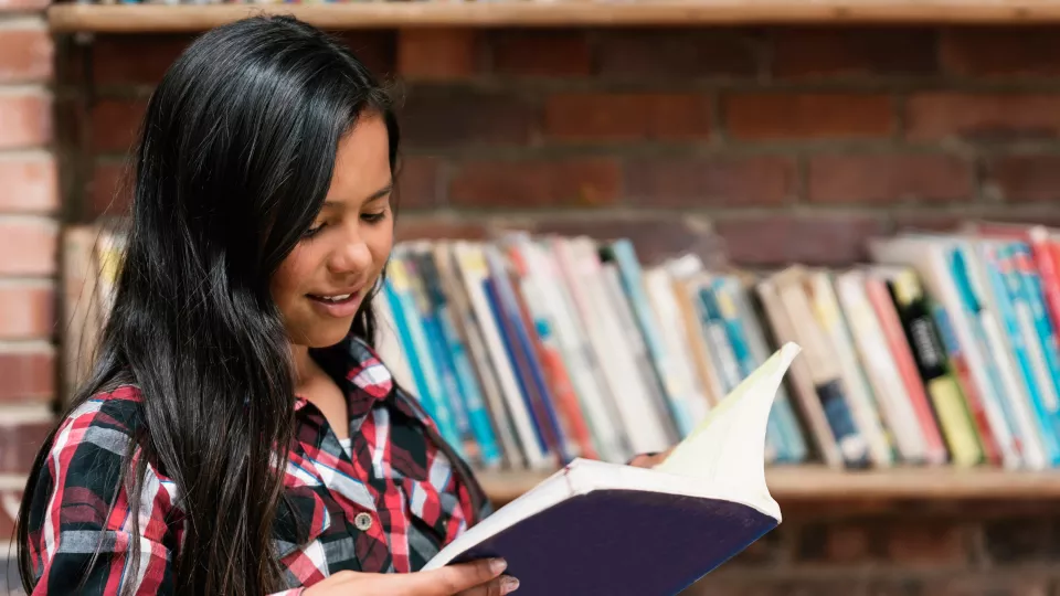 Young Teen Reads in Library